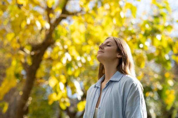 istock Woman with closed eyes in nature 2098823741