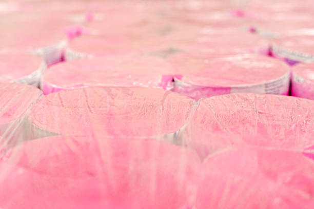 pink toilet paper in transparent plastic packaging