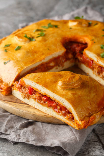 istock Spanish Empanada Gallega Galician Pork and Pepper Pie closeup on the board. Vertical 2098843690