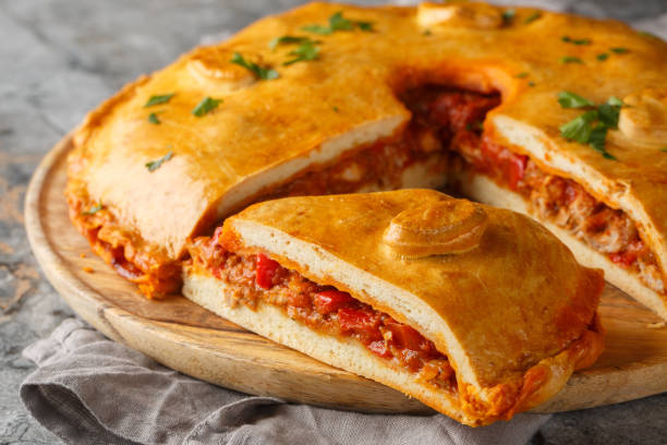 istock Empanada Gallega Traditional pie stuffed with tuna or meat and vegetables typical from Galicia, Spain closeup on the board. Horizontal 2098843702