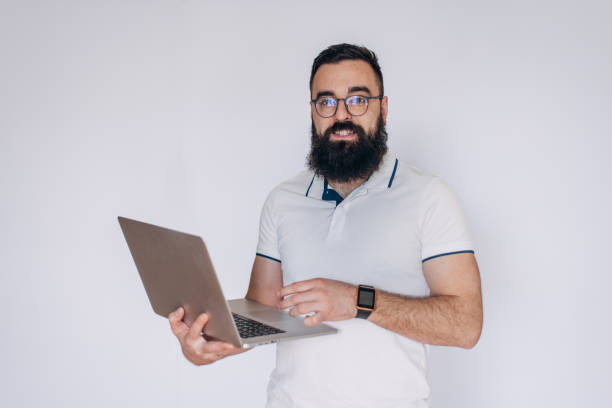 istock Portrait of a man with laptop on white background 2098845762