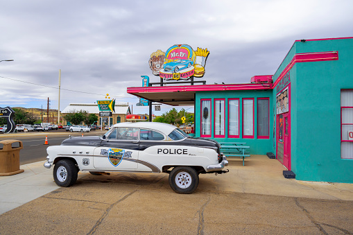 Kingman, Arizona, United States - September 23, 2023: Route 66 Mr D'Z  colourful restaurant with a vintage car in front