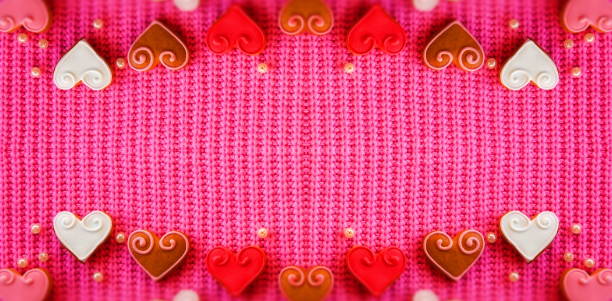 istock Abstract Creative background for Valentine's day. Red Hearts on a Pink Background. Symmetrical Composition 2098873514