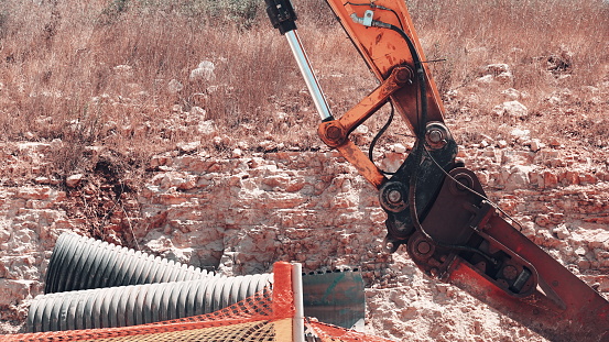 Industrial Excavator At Work On Construction Site, Arm Of Machinery Operating With Precision