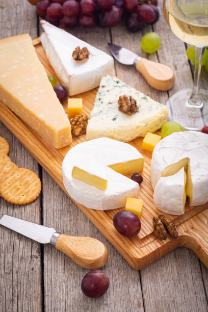 istock Differnt kind of cheese on the wooden board 2098888179