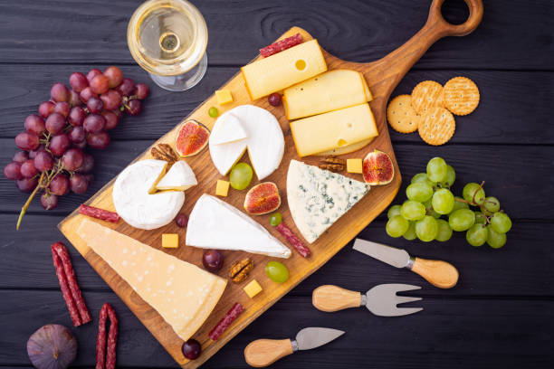 istock Differnt kind of cheese on the wooden board 2098888185