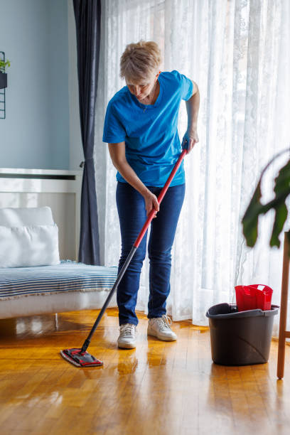 istock Woman Mopping Living Room 2098888743