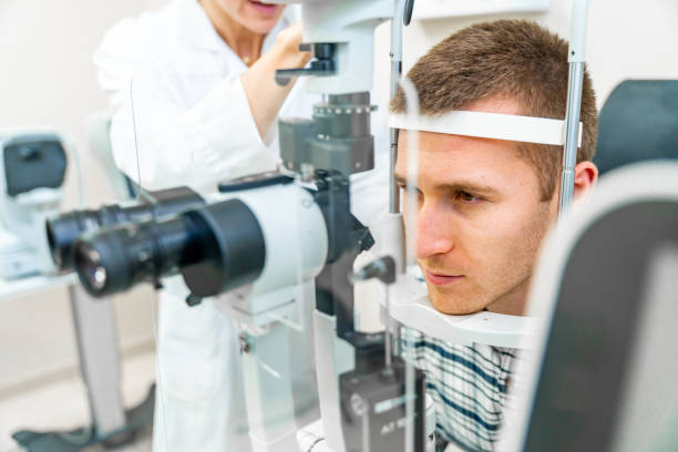 istock Man having his eyes checked at ophthalmologist 2098904454
