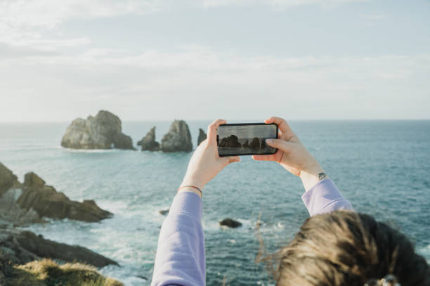 istock Woman taking a picture with a smart phone 2098910139