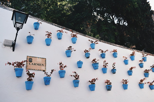 flower pots on a wall in Marbella in Andalusia, Spain, on August 2, 2017