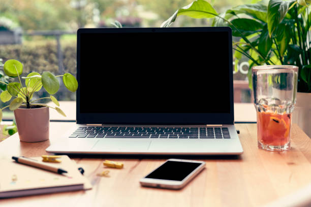 istock Blank device sreen from computer on office desk in modern room with mockup. 2098919546
