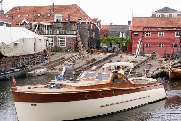 Private small boat with 4 passengers moving along the canal stock photo