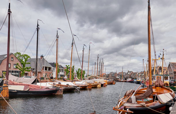 Canal with fishing boats in the center of village Spakenburg. stock photo