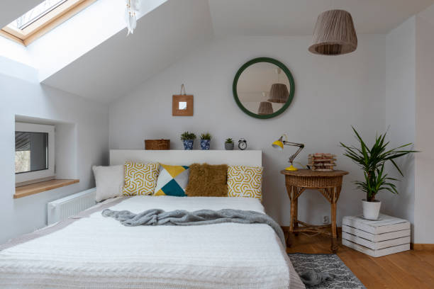 istock Cosy bedroom in the attic in boho style with comfortable bed. 2099016579