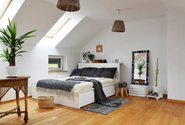 istock Home interior with Cosy bedroom in the attic in boho style with comfortable bed and grey pillow. 2099024089