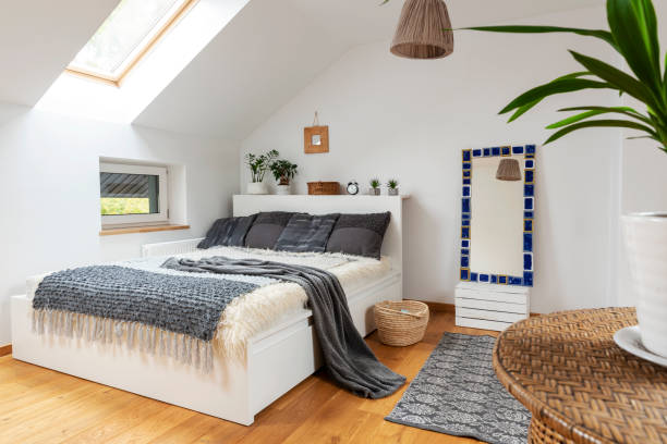 istock Home interior with Cosy bedroom in the attic in boho style with comfortable bed and grey pillow. 2099024868