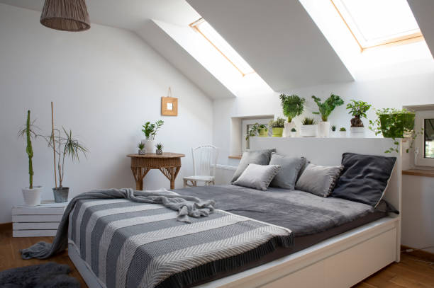 istock Home interior with Cosy bedroom in the attic in boho style with comfortable bed and grey pillow. 2099030567