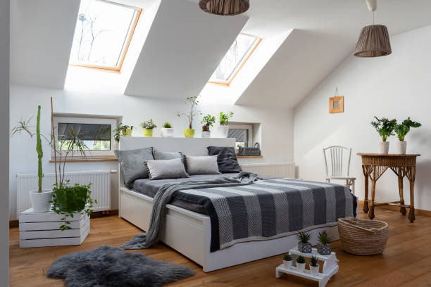 istock Home interior with Cosy bedroom in the attic in boho style with comfortable bed and grey pillow. 2099030568