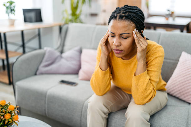 istock Young Woman Having A Headache At Home 2099048785