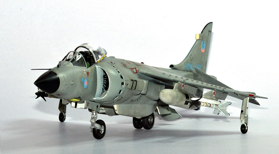 Front-left view of a Sea Harrier FRS.1 model in light gray color carrying full full air-to-air combat load on white background.