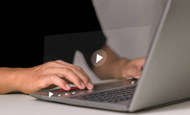 istock Man using laptop for streaming online, watching video on internet, live concert, show or tutorial 2099060344