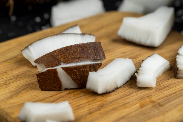istock white coconut pulp and dried coconut flakes 2099063518
