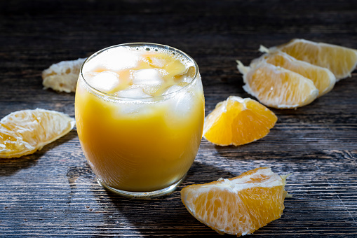orange juice with ice and orange slices, cold orange orange with ice