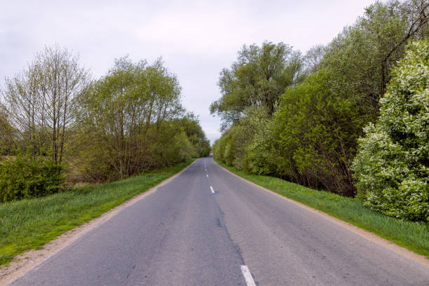 istock windy cloudy weather and highway in rural areas 2099064737