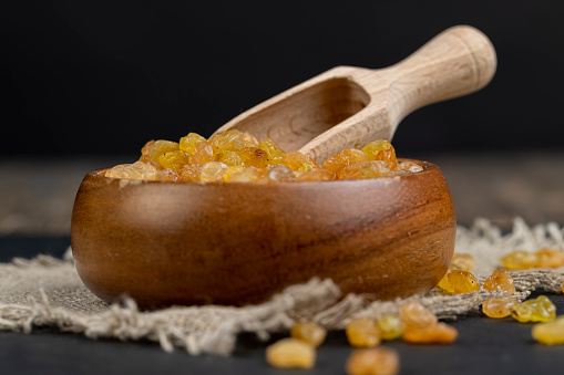 golden raisins on the kitchen table, sweet yellow raisins from grapes