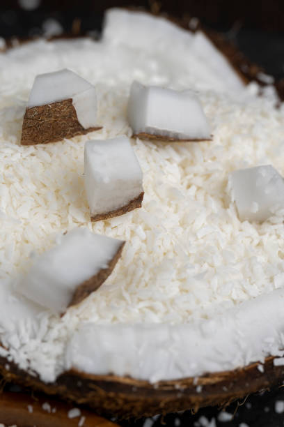 istock white coconut pulp and dried coconut flakes 2099065848