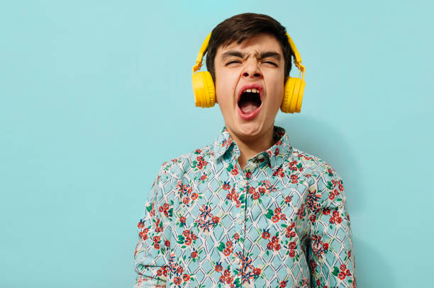 istock Young guy with headphones in studio.. 2099076962