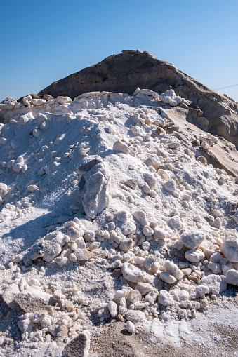 Piles of salt in the salt flats of Iptuci in Prado del Rey, Cadiz province, Andalusia, Spain. Settling ponds for salt production by evaporation.