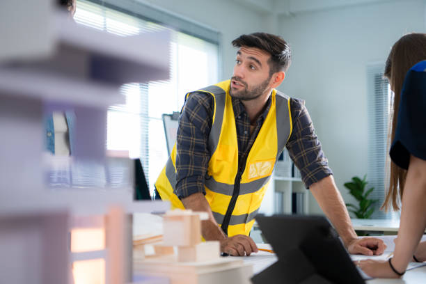 istock Engineers, architects, and designers collaborate to design a building that employs natural energy. 2099105281