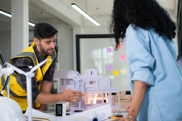 istock Engineers, architects, and designers collaborate to design a building that employs natural energy. 2099114108