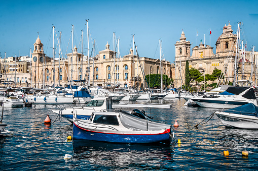 Beautiful Ships And Fishing Boats On Cospicua Harbor In Front Of St. Lawrence Church, Malta