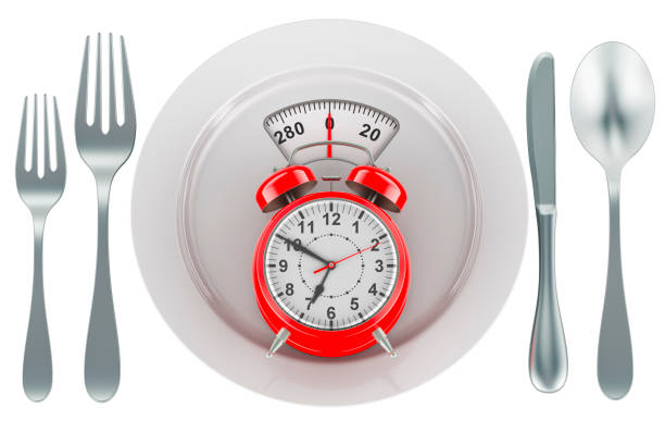 istock Alarm clock on dinner plate with weight scale. Intermittent fasting, lunchtime, diet and weight loss, concept. 3D rendering 2099137493