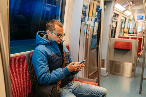 istock Young Man Using Phone In A Subway Train In Hamburg In Germany 2099144893