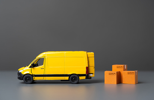 Delivery van and boxes. Logistics and industry. House moving. Delivery of online orders and purchases. Supply of goods