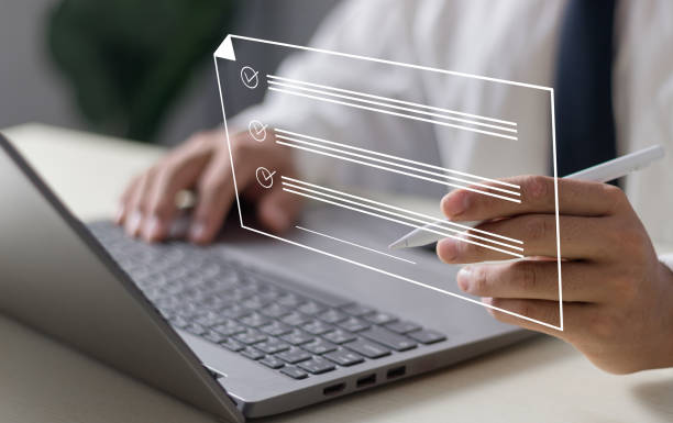 istock Electronic Signature Concept, Electronic Signing Businessman signs electronic documents on digital documents on virtual laptop screen using stylus pen. 2099150626
