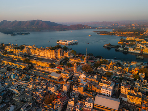 Scenic aerial view of Udaipur Palace  and Pichola lake at sunrise