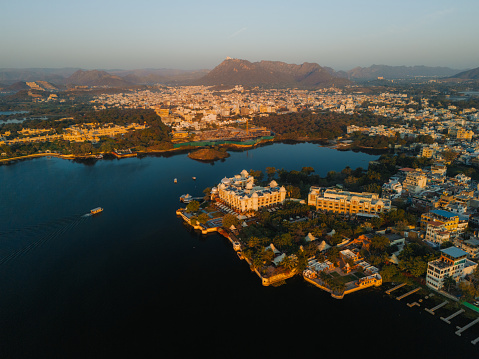 Scenic aerial view of Udaipur Palace  and Pichola lake at sunrise