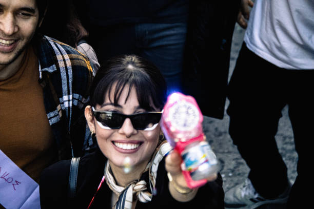 Portrait of happy Japanese businesswoman having fun during an office party and looking at camera. Copy space.