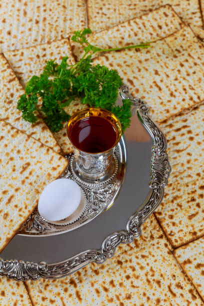 istock Pesach celebration is rich tradition symbolism with red kosher wine a unleavened bread matzo 2099176490