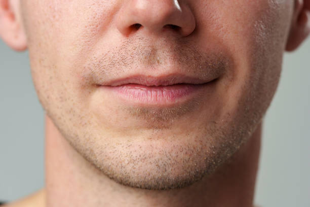 Close up shot of a young man face skin