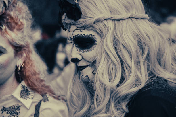 Athens, Greece - March, 2024. Disguised people in colourful costumes dance during the annual carnival parade at Metaxourgeio in Athens.