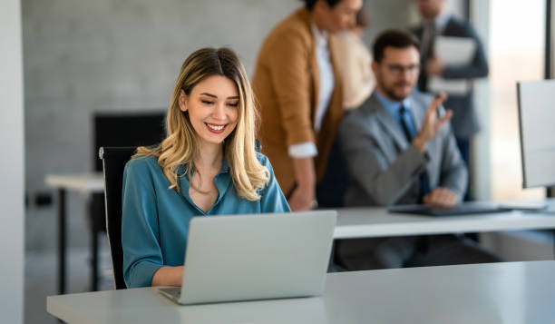 istock Successful businesswoman using laptop, working in office. Business technology corporate concept 2099200122