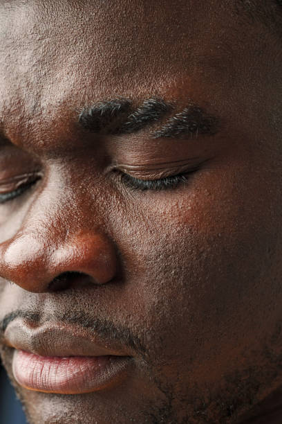 istock Close Up of African Mans Face With Brown Eyes 2099207913