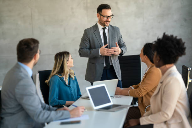 istock Team leader discussing and brainstorming new approaches and ideas with colleagues. 2099215187