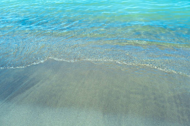 istock Sandy seashore and waves. Marine background 2099234041