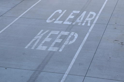 Keep clear pavement marking sign